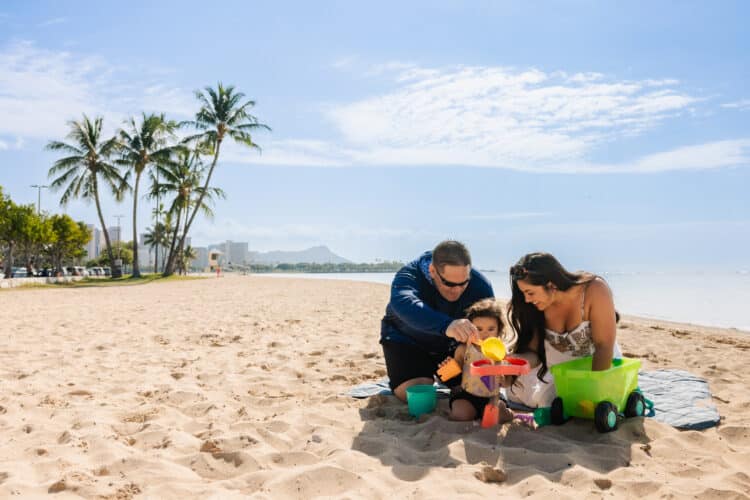 Family enjoying Ala Moana Beach Park near Pagoda Hotel in Honolulu